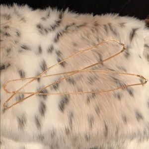 Gold tone omega layering chains